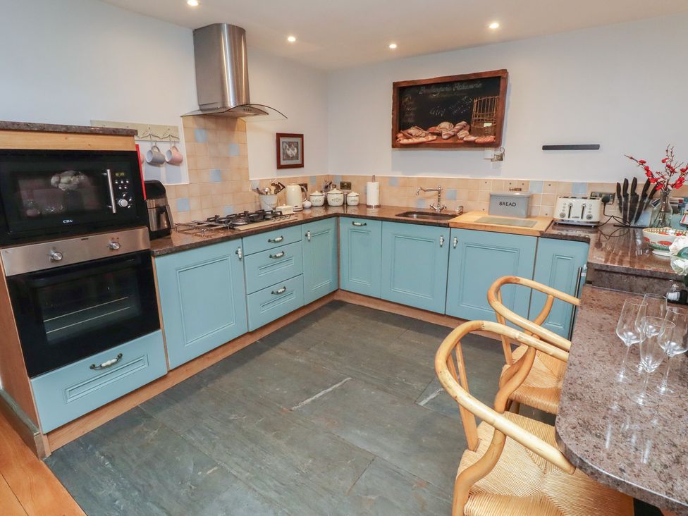 A kitchen with cabinets and appliances at The French in 