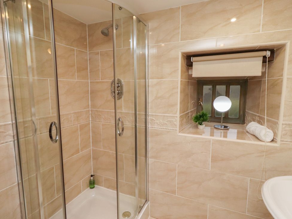 A bathroom with a shower and a window at The French in 