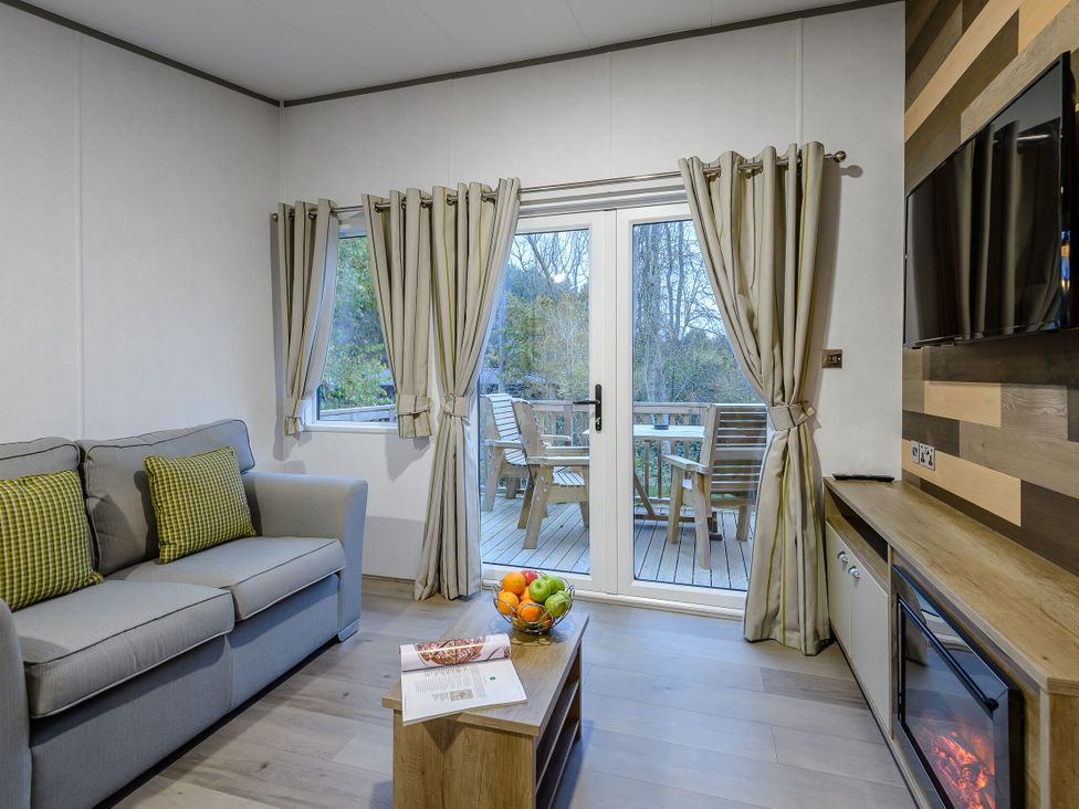 A living room with a sofa and coffee table at Anderby Spa (Pet) in Louth