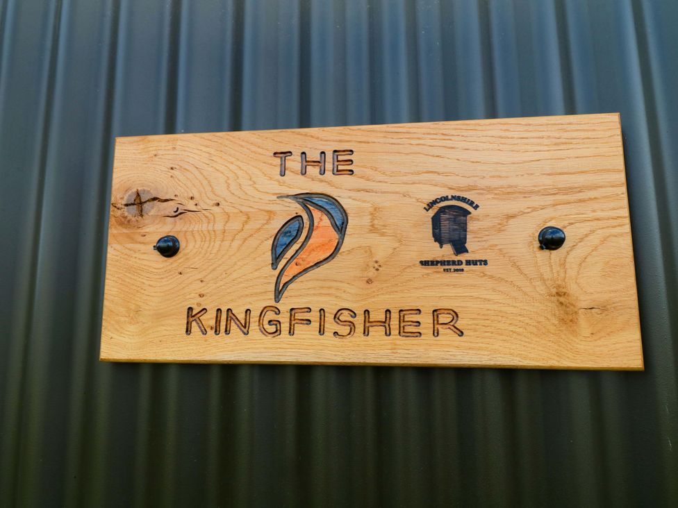 A sign with the name The Kingfisher at Kingfisher Hut