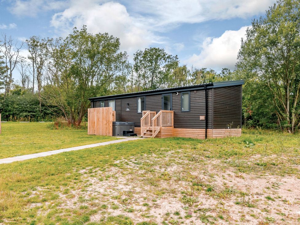 A mobile home with steps in an outdoor area at Horncastle Plus in Louth