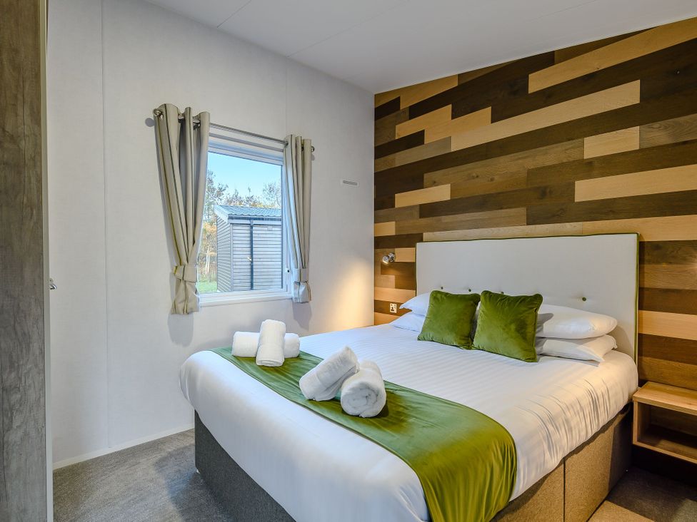 A bedroom with a double bed and window at Horncastle Plus in Louth