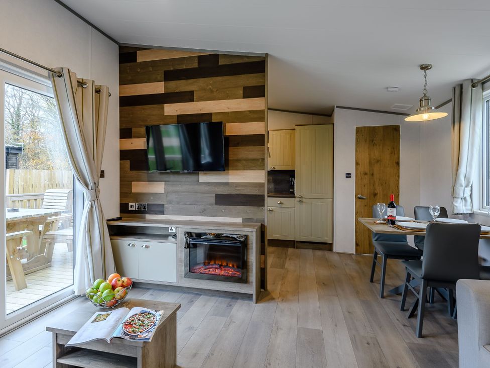 A living room with a television and fireplace at The Kinder Spa in Louth