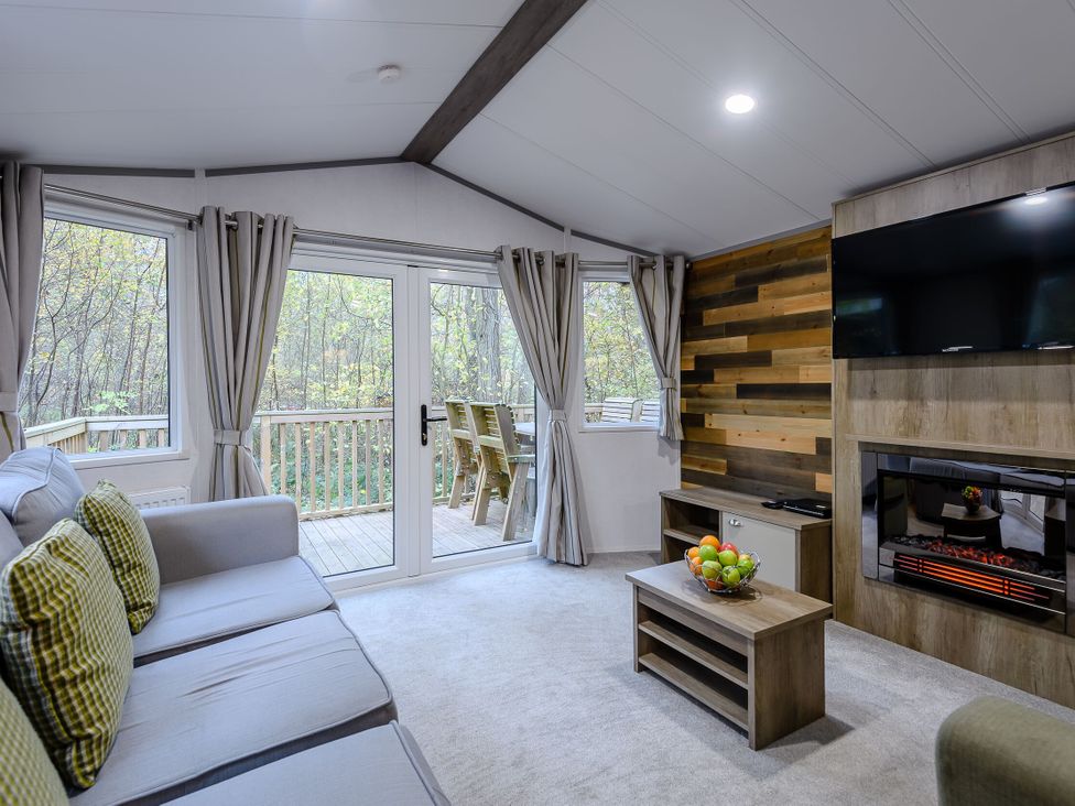 A living room with a sofa and television at Alford Spa (Pet) in Louth