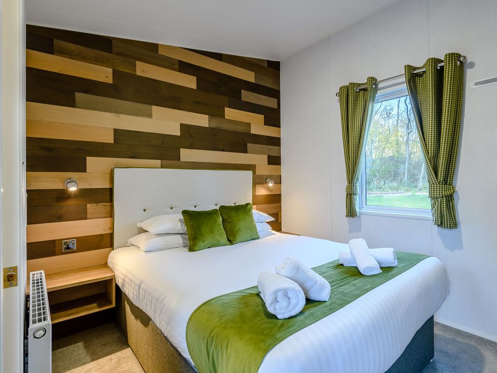 A bedroom with a bed and window at Horncastle Plus (Pet) Louth