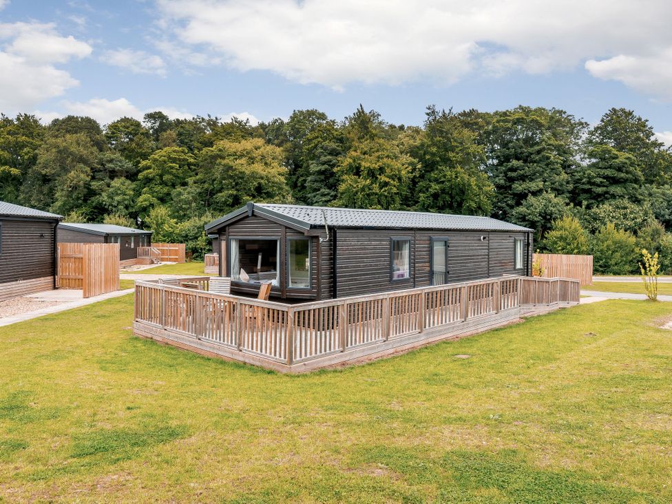 A lodge with decking and a garden area at Alford WF in Louth