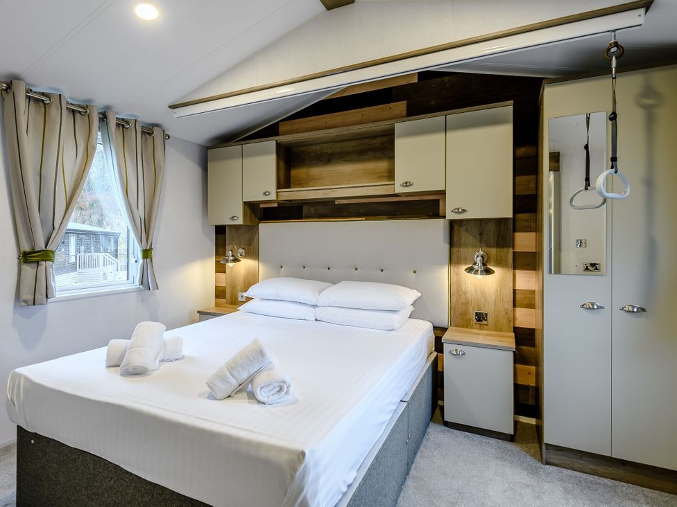 A bedroom with a double bed and shelves at Alford WF in Louth