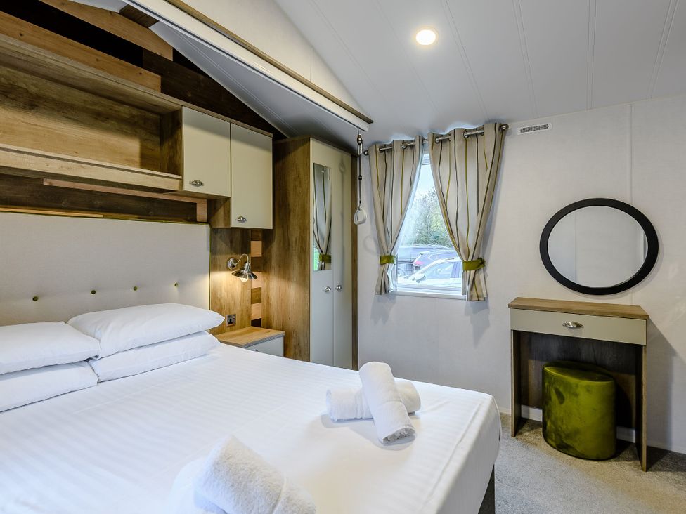 A bedroom with a bed and nightstand at Alford WF in Louth