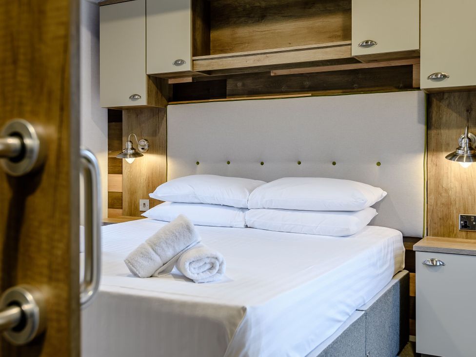 A bedroom with a bed and shelves at Alford WF in Louth