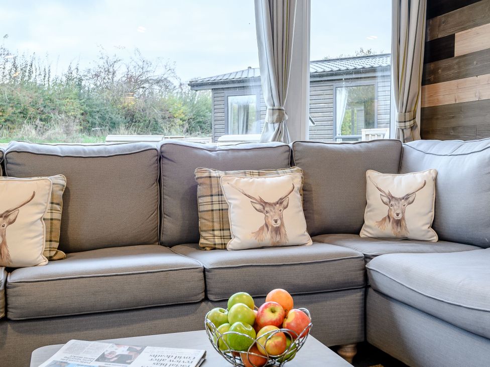 A living room with a sofa and a fruit bowl at Alford WF in Louth