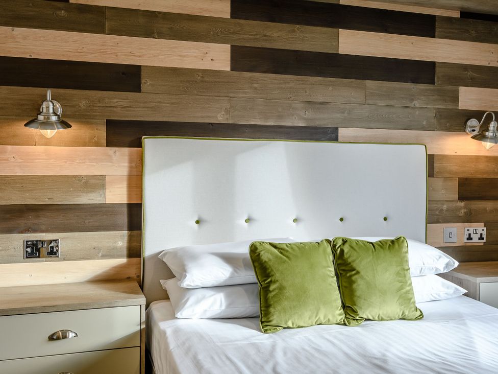 A bedroom with a bed and headboard at Elsham Lodge Louth