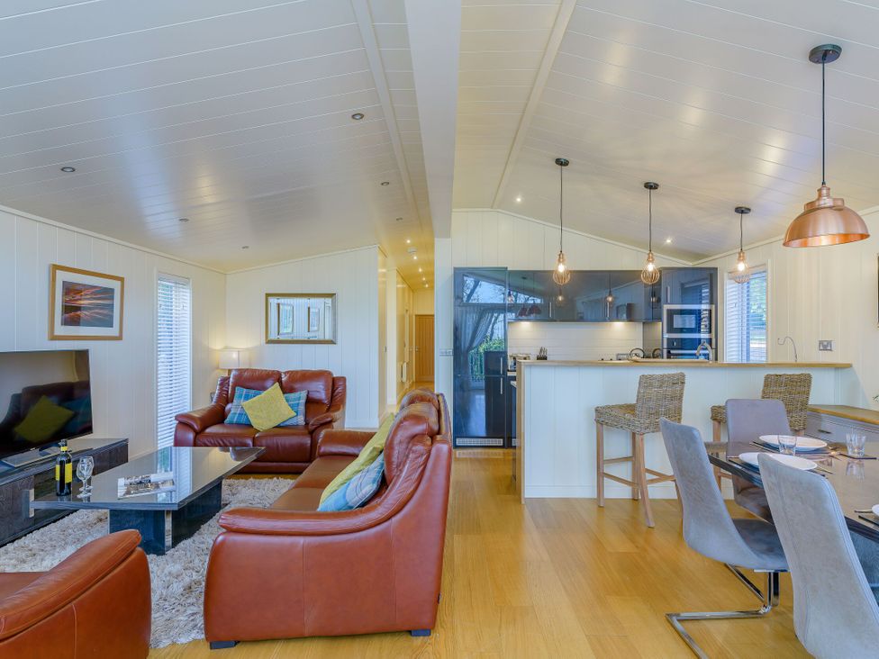 A living room with a sofa and coffee table at Retreat Lodge 4 in Louth