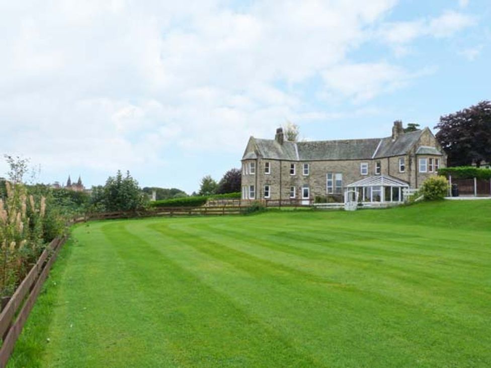 A house with a garden and fence at Priory View in Ulverston