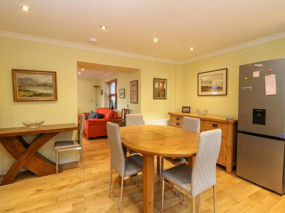 A dining room with a table and chairs at 78 Findhorn in Forres