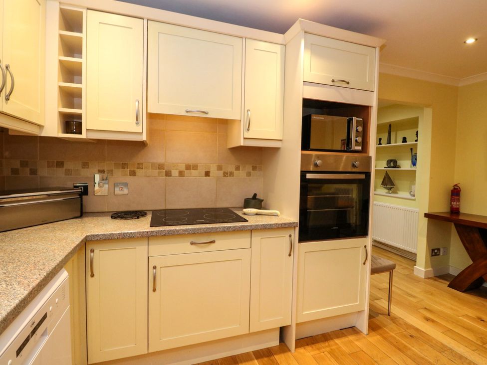 A kitchen with cabinets and appliances at 78 Findhorn in Forres