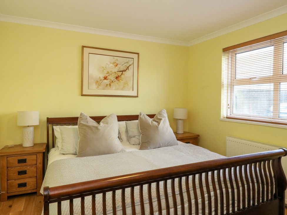 A bedroom with a bed and bedside tables at 78 Findhorn in Forres