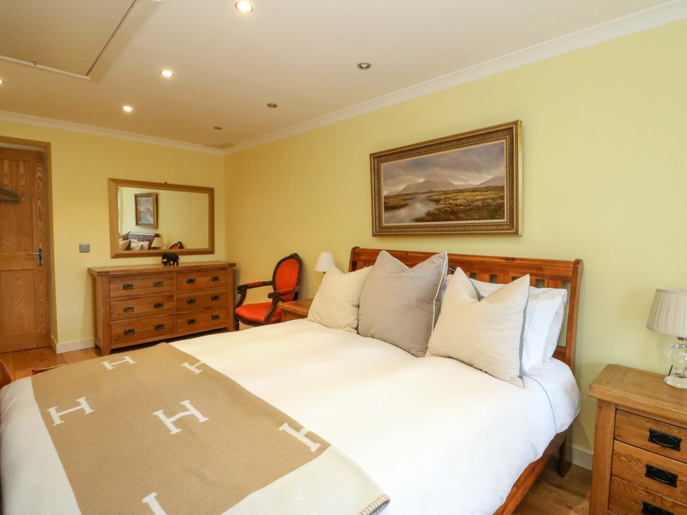 A bedroom with a bed and dresser at 78 Findhorn in Forres