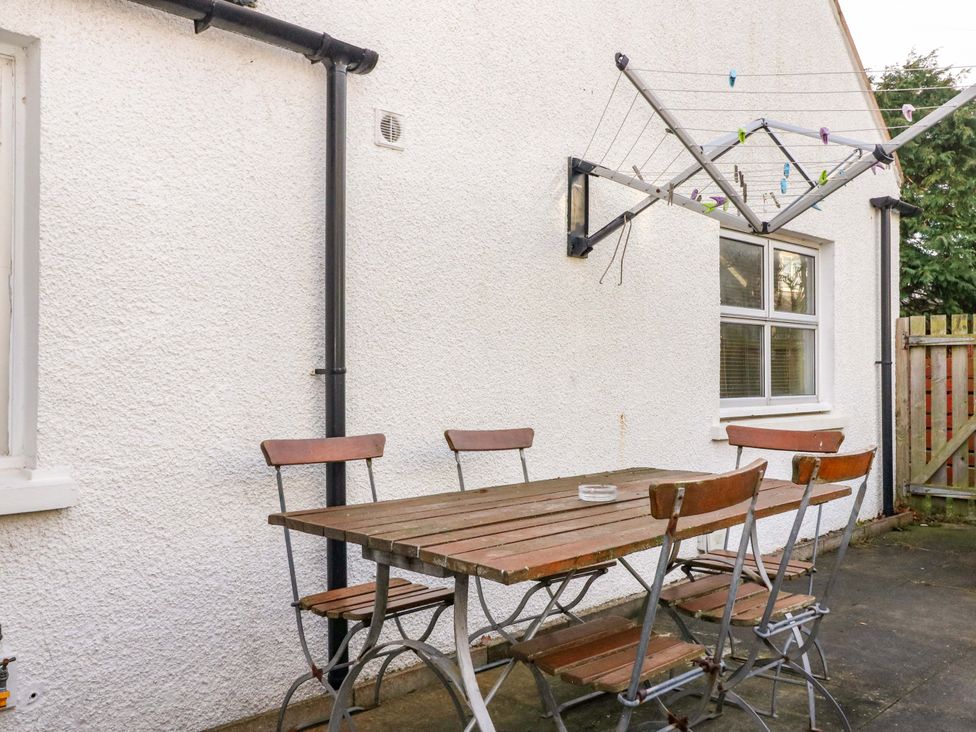 An outdoor area with a table and chairs at 78 Findhorn in Forres