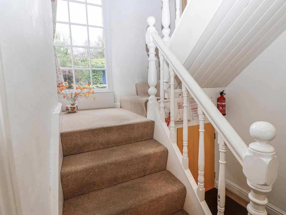 A staircase leading to an upper level at Ivy Cottage in West Burton
