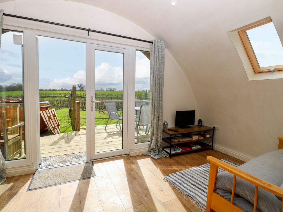 A living room with a view of the outdoors at Grape Escape near Halesworth