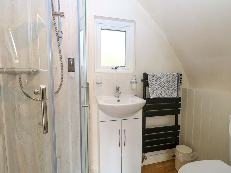 A bathroom with shower, sink and toilet at Grape Escape near Halesworth