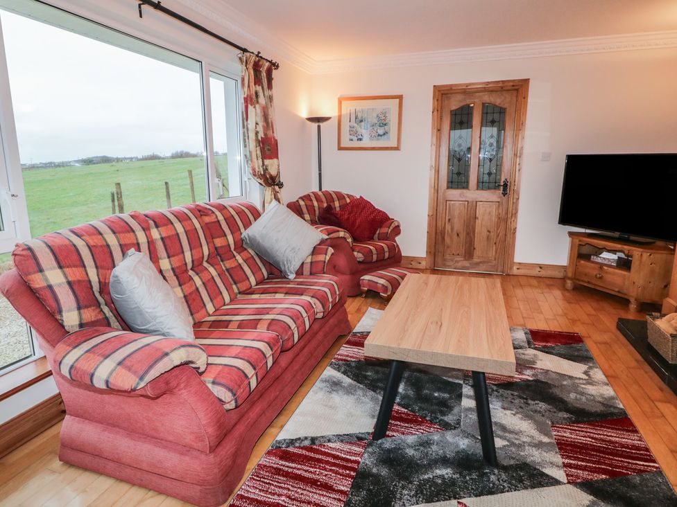 A living room with a sofa and coffee table at Bungalow Falcarragh, Falcarragh, County Donegal