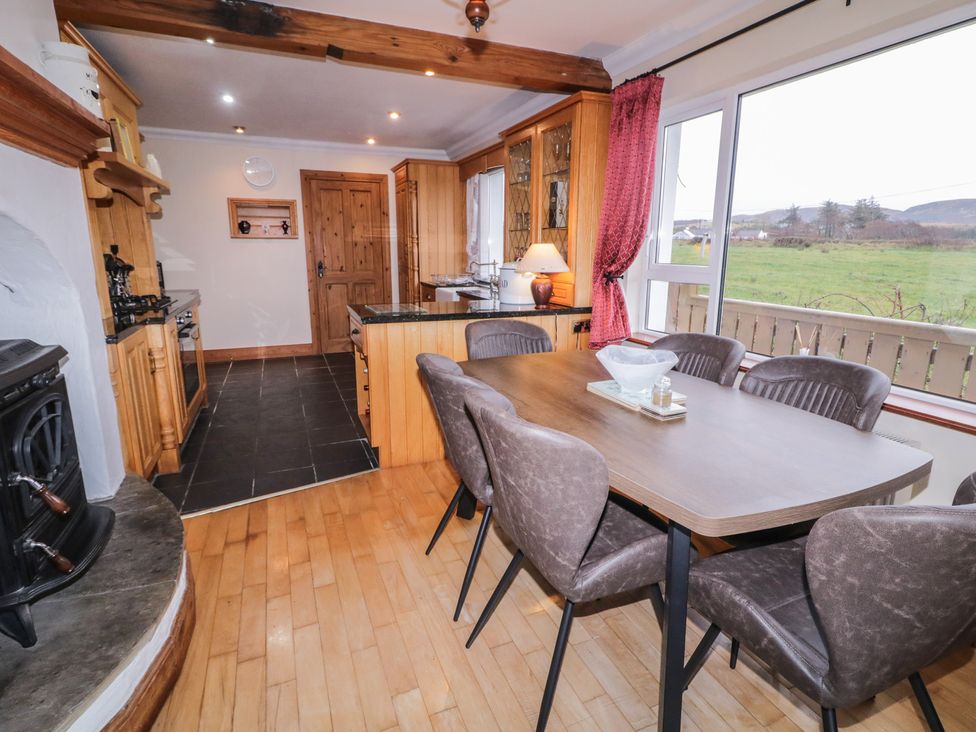 A kitchen with a dining table and chairs at Bungalow Falcarragh, County Donegal