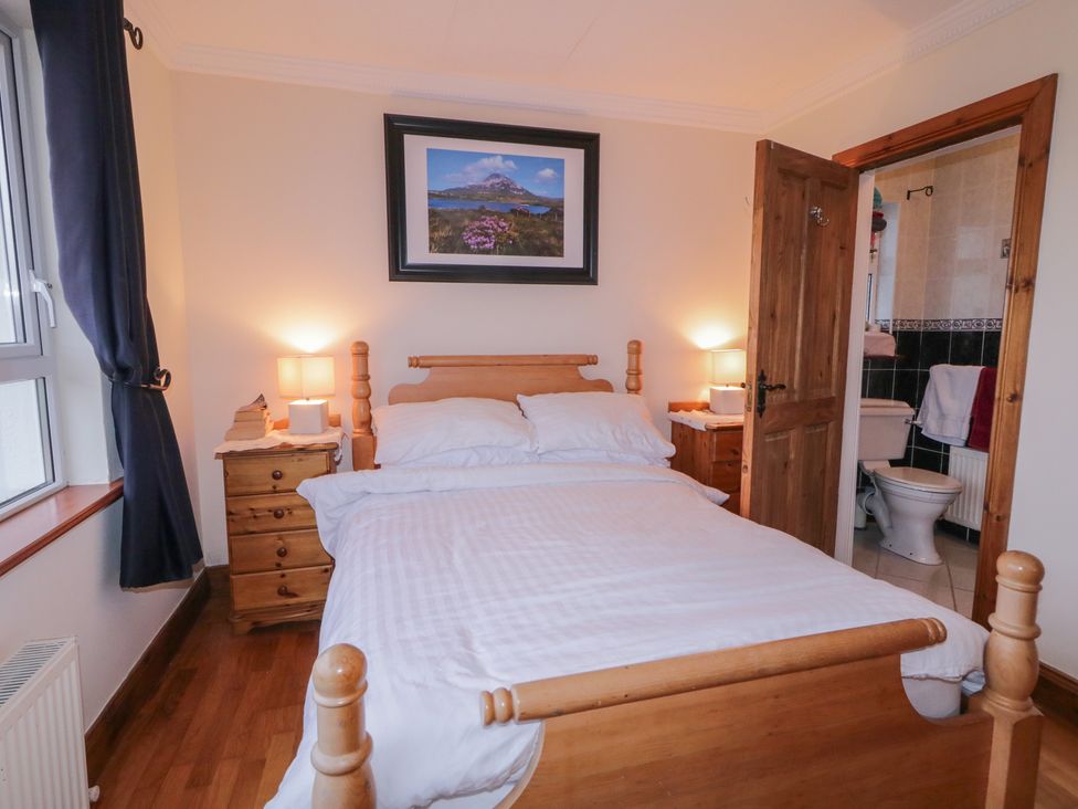 A bedroom with a bed and bedside table at Bungalow Falcarragh, Falcarragh, County Donegal