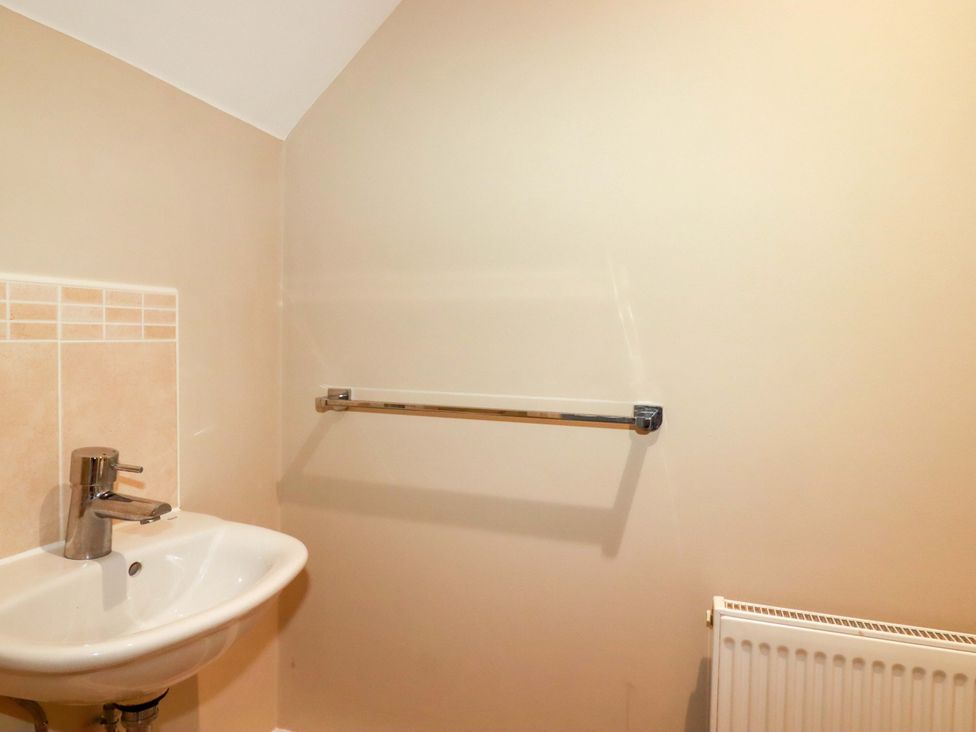 A bathroom with a sink and tap at 3 Rope Walk in St. Austell