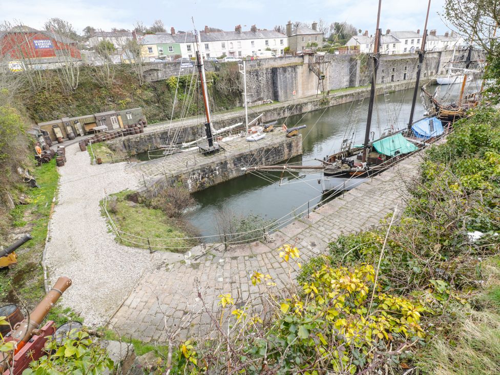 A view of boats at a dock with a pathway at 3 Rope Walk Duporth near Charlestown