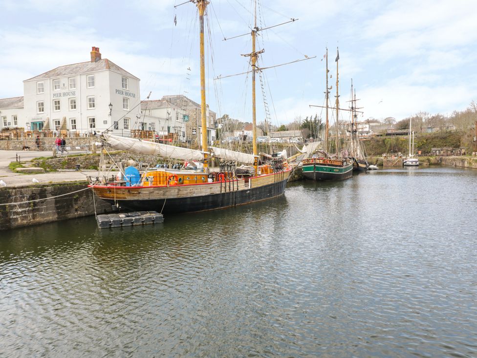 Boats in a harbor by Pier House at 3 Rope Walk, Duporth near Charlestown
