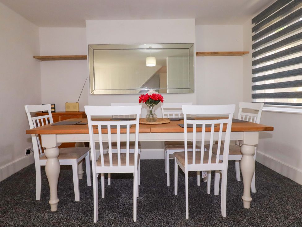 A dining room with a table and chairs at 39 Trevarthian road St Austell