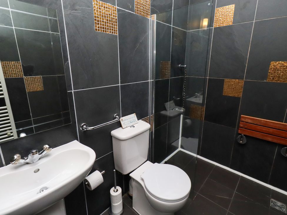 A bathroom with a sink and shower at The Opulent in Hexham