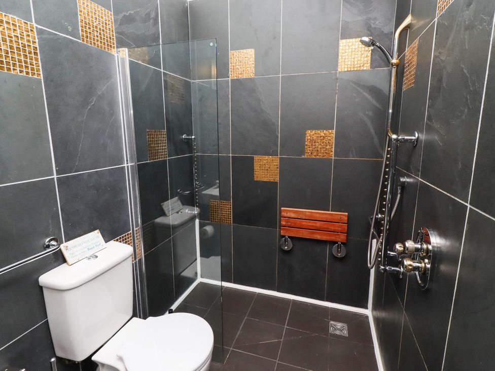 A bathroom with a shower and toilet at The Opulent in Hexham