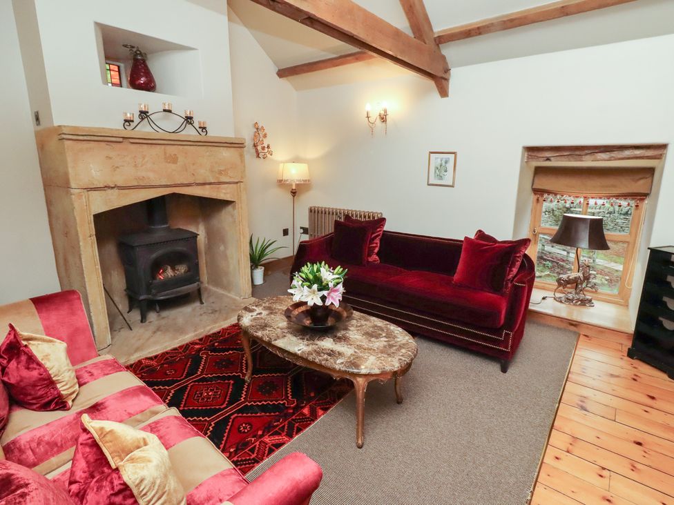 A living room with sofa and coffee table at The Classic in Hexham