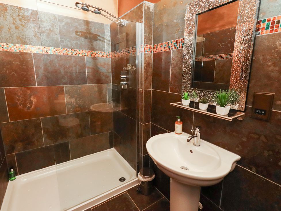 A bathroom with a shower and sink at The Classic in Hexham