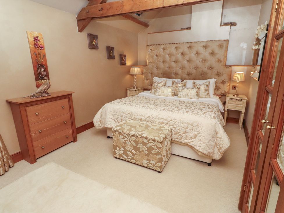 A bedroom with a bed and bedside tables at The Classic in Hexham