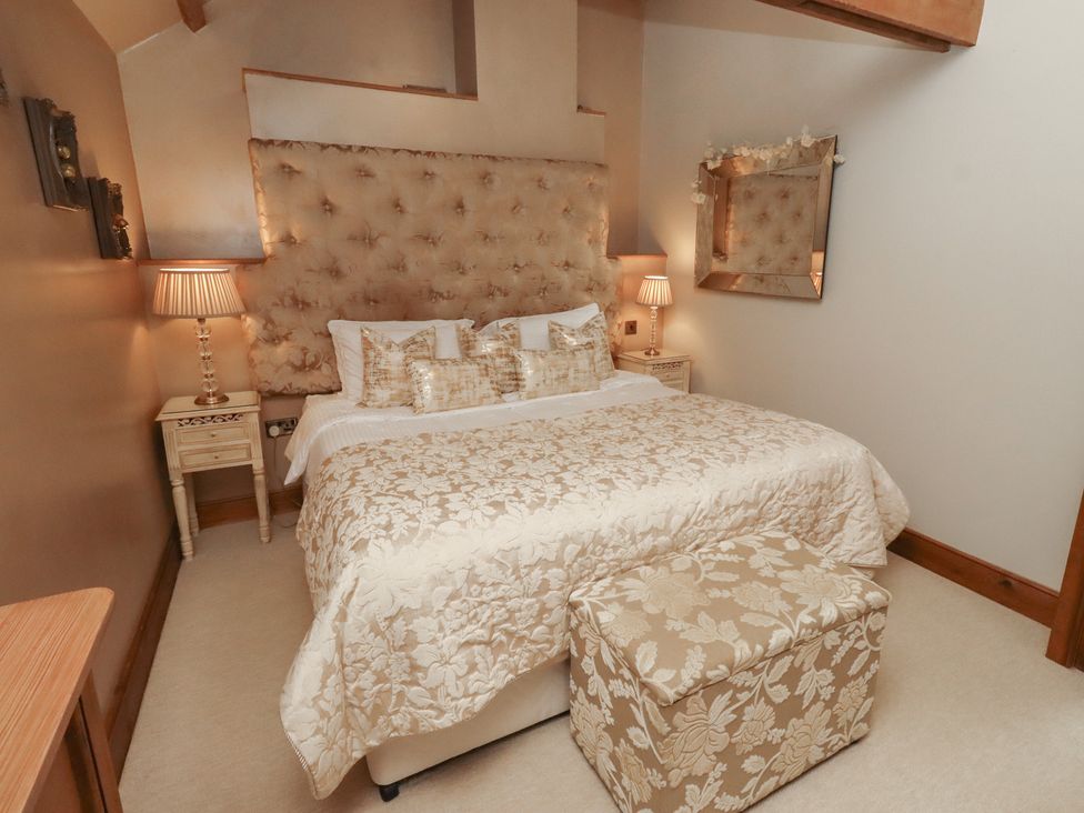 A bedroom with a bed and bedside tables at The Classic in Hexham
