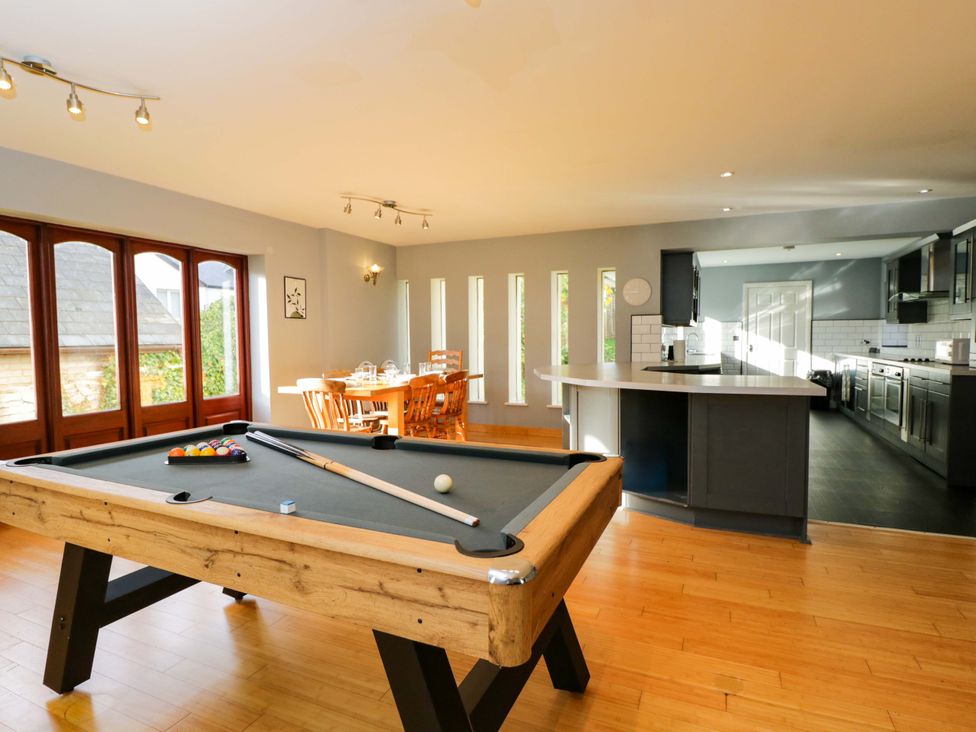 A game room with a pool table and dining table at Lady Of Lourdes in Whitchurch, Herefordshire