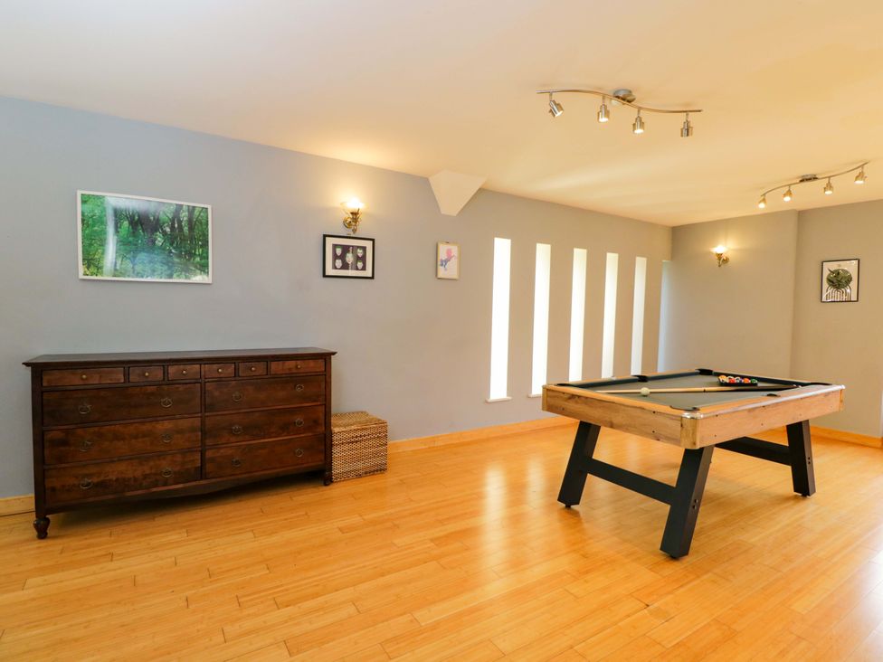 A game room with a pool table and chest of drawers at Lady Of Lourdes in Whitchurch, Herefordshire