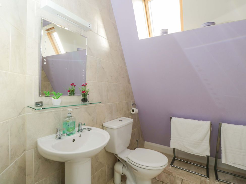 A bathroom with a sink and toilet at Lady Of Lourdes in Whitchurch, Herefordshire