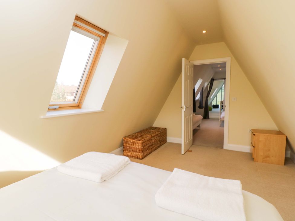 A bedroom with a bed and window at Lady Of Lourdes Whitchurch, Herefordshire