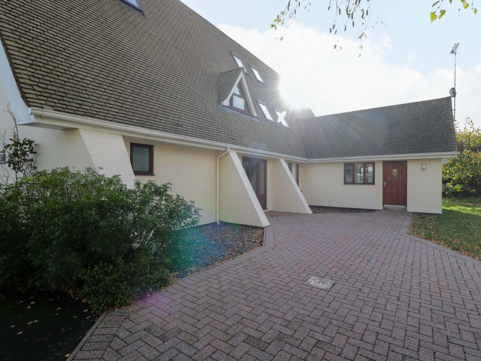 An exterior view of a house with a pathway and garden at Lady Of Lourdes in Whitchurch, Herefordshire