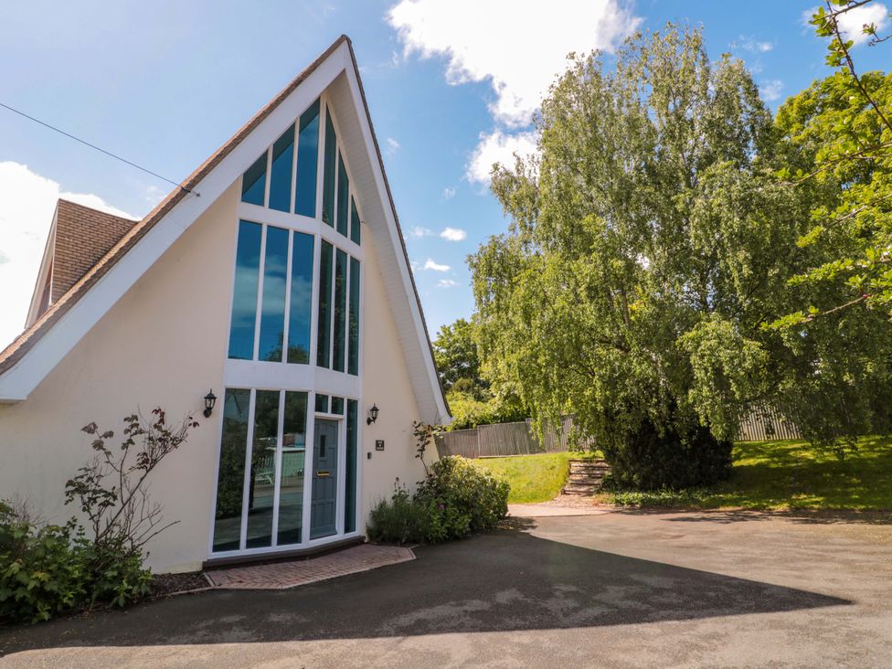 A house with large windows and a pathway leading up at Lady Of Lourdes Whitchurch, Herefordshire