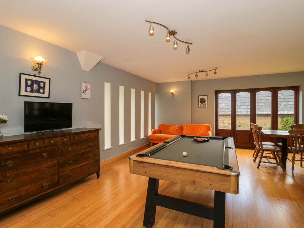 A game room with a billiard table and dining area at Lady Of Lourdes Whitchurch, Herefordshire