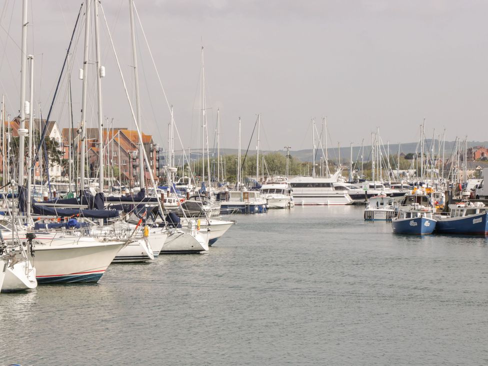 A marina filled with sailboats and yachts at Rodwell Holt in Weymouth