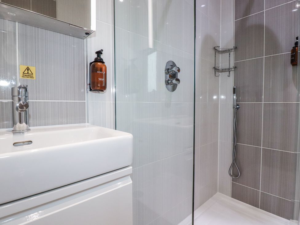 A bathroom with a sink and shower at Adelaide in Redruth