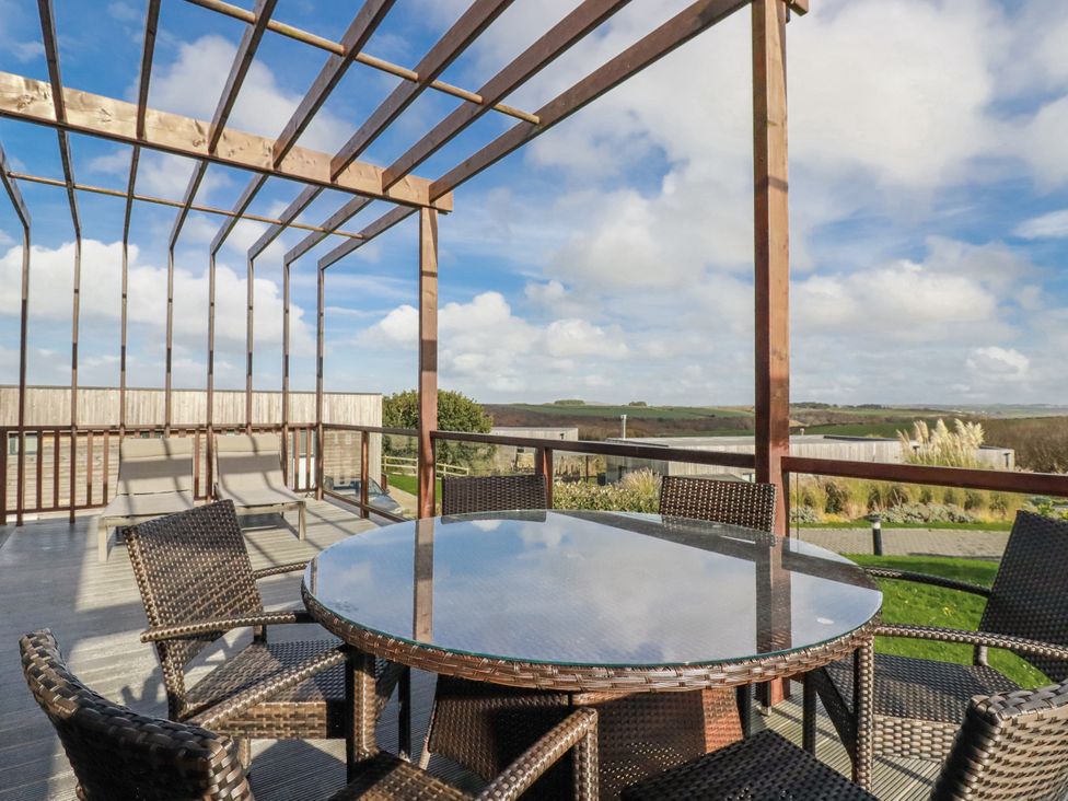 An outdoor dining area with a table and chairs at Adelaide in Redruth