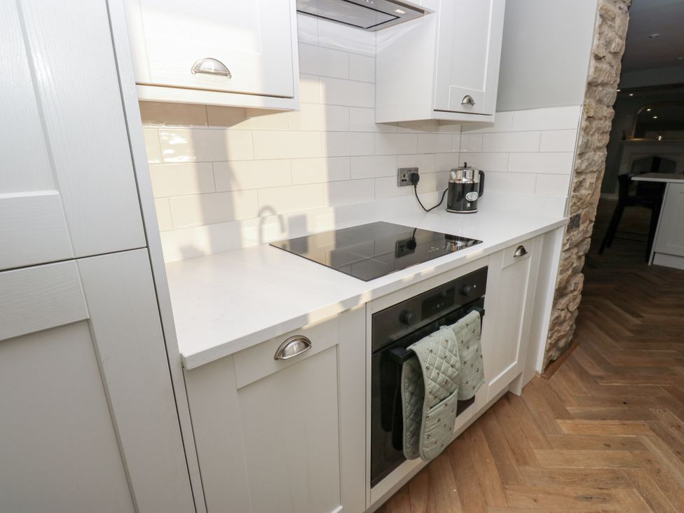 A kitchen with cabinets and countertop at The Robins Nest