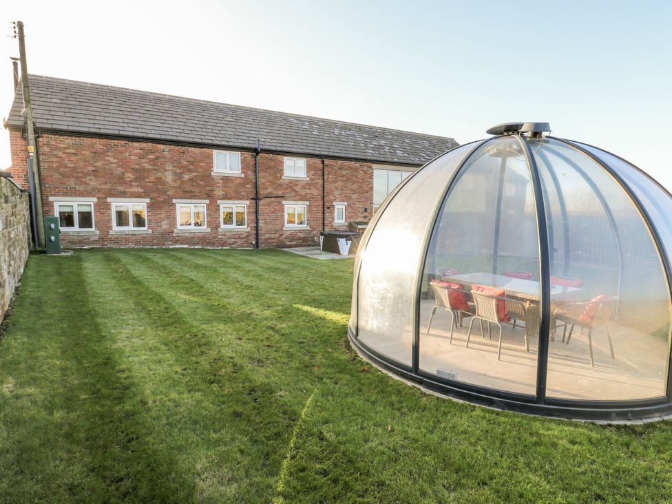 A house with a garden and a dome structure at The Robins Nest in 